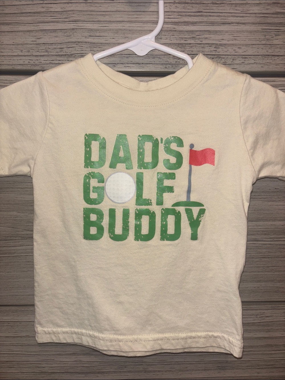 Cream Short Sleeve Kids Tee with Green 'Dad's Golf Buddy' Graphic
